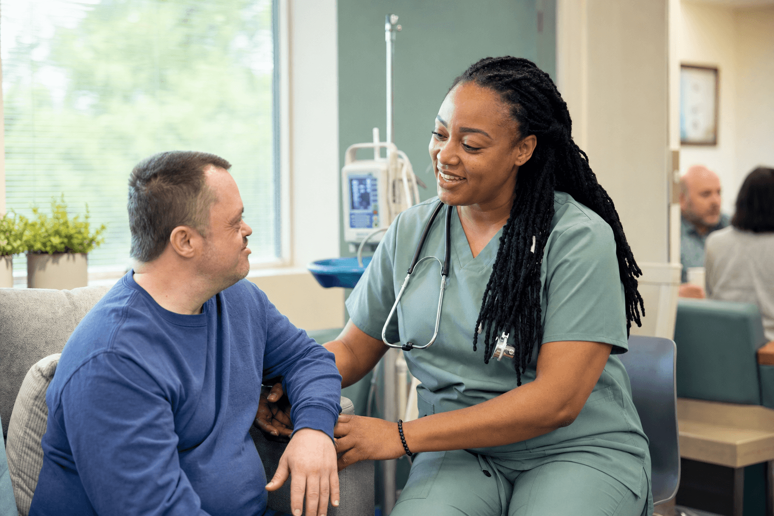 A nurse supporting an adult with a developmental disability during the day at a Franklin Park adult day program